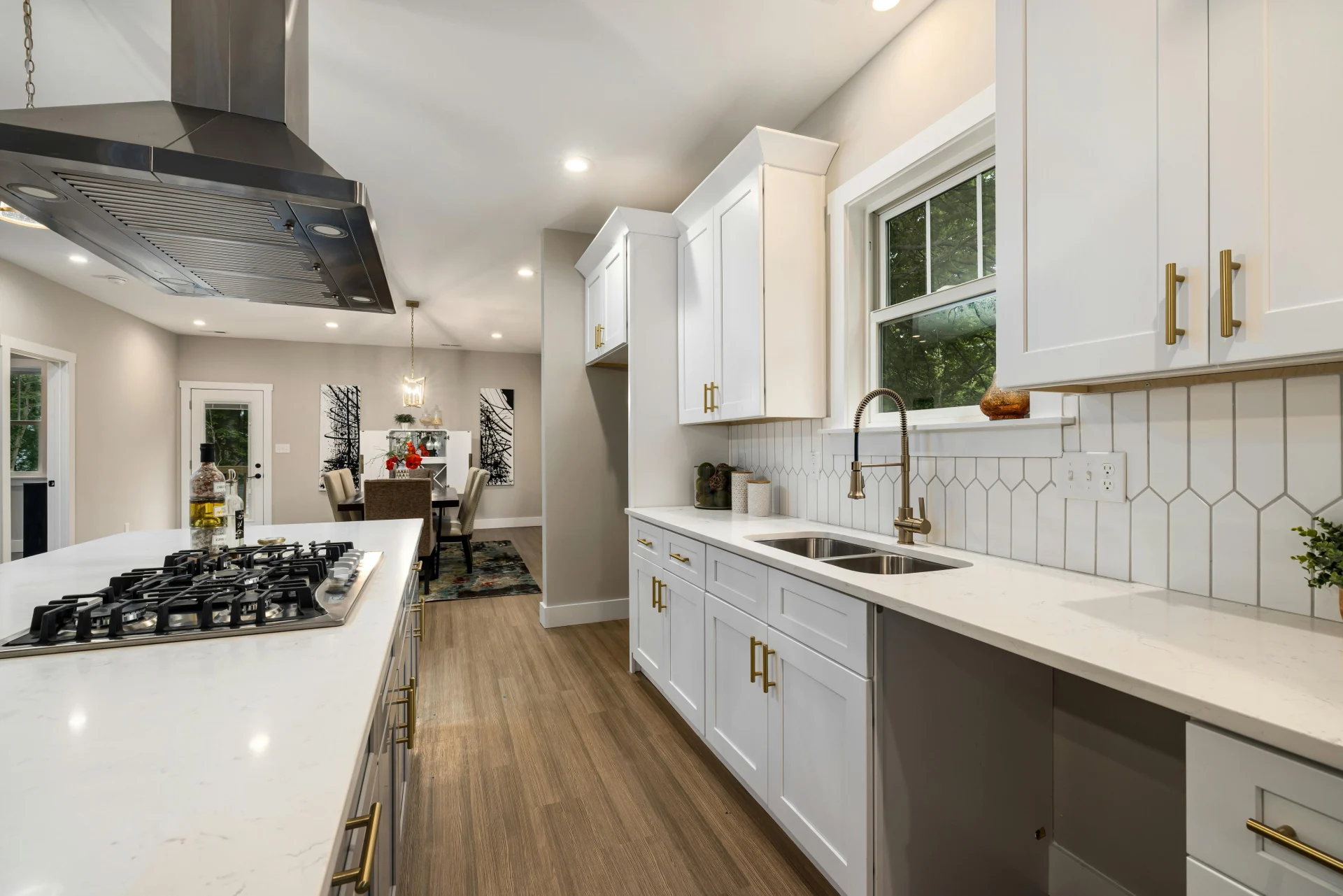 Large kitchen with range and hood in island