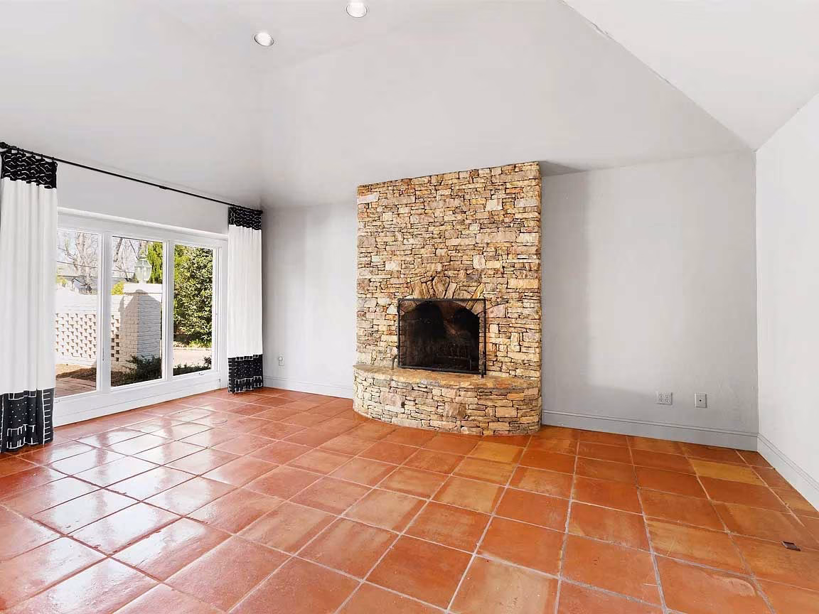 family room with stone fireplace